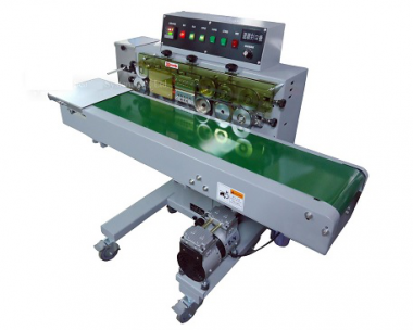 Horizontal nozzle vacuum band sealer